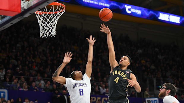 Jan 15, 2025; Seattle, Washington, USA; Purdue Boilermakers forward Trey Kaufman-Renn (4) shoots the ball over Washington Hus