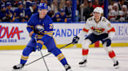 Oct 28, 2024; Buffalo, New York, USA;  Buffalo Sabres defenseman Rasmus Dahlin (26) control the puck as Florida Panthers center Jesper Boqvist (70) defends during the first period at KeyBank Center. Mandatory Credit: Timothy T. Ludwig-Imagn Images