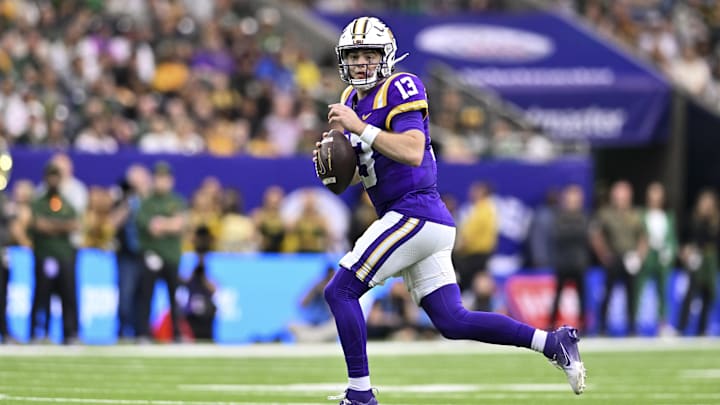 Dec 31, 2024; Houston, TX, USA; LSU Tigers quarterback Garrett Nussmeier (13) runs the ball during the first half against the Baylor Bears at NRG Stadium. Mandatory Credit: Maria Lysaker-Imagn Images 