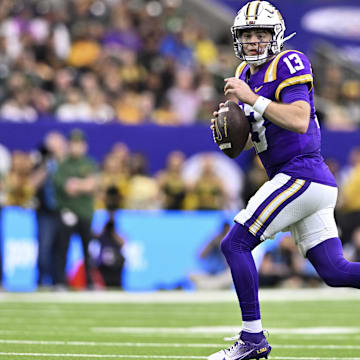 Dec 31, 2024; Houston, TX, USA; LSU Tigers quarterback Garrett Nussmeier (13) runs the ball during the first half against the Baylor Bears at NRG Stadium. Mandatory Credit: Maria Lysaker-Imagn Images 