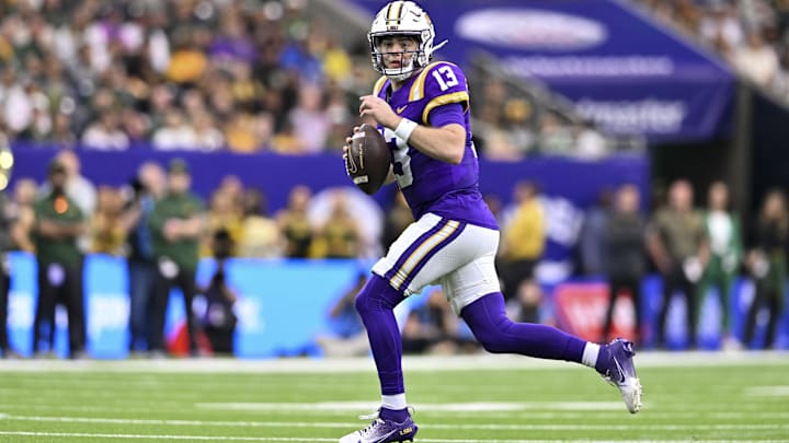 Dec 31, 2024; Houston, TX, USA; LSU Tigers quarterback Garrett Nussmeier (13) runs the ball during the first half against the Baylor Bears at NRG Stadium. Mandatory Credit: Maria Lysaker-Imagn Images 