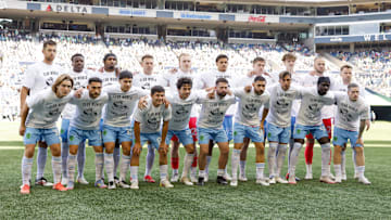 Jun 1, 2025; Seattle, Washington, USA; Seattle Sounders FC players pose for a photo while wearing t-shirts to protest FIFA Club World Cup bonus sharing from MLS before a game against the Minnesota United at Lumen Field. Mandatory Credit: Joe Nicholson-Imagn Images