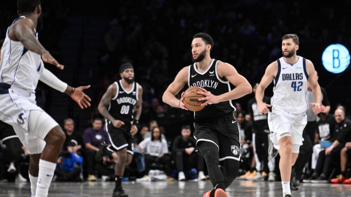 Feb 6, 2024; Brooklyn, New York, USA; Brooklyn Nets guard Ben Simmons (10) passes the ball as Dallas Mavericks forward Tim Hardaway Jr. (10) and forward Maxi Kleber (42) pursue during the second quarter at Barclays Center. Mandatory Credit: John Jones-USA TODAY Sports