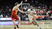 Feb 23, 2025; Piscataway, New Jersey, USA; Rutgers Scarlet Knights guard Jeremiah Williams (25) drives to the basket while being defended by USC Trojans guard Clark Slajchert (32) during the second half at Jersey Mike's Arena. Mandatory Credit: John Jones-Imagn Images