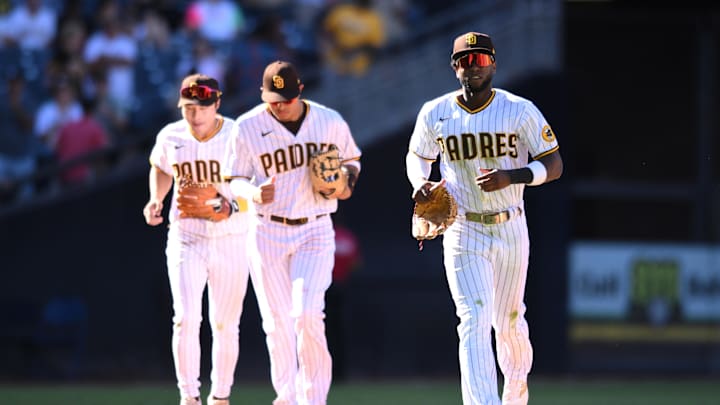 Sep 22, 2022; San Diego, California, USA; San Diego Padres left fielder Jurickson Profar (right) runs to the dugout followed by third baseman Manny Machado (center) and shortstop Ha-Seong Kim (left) during the middle of the ninth inning against the St. Louis Cardinals at Petco Park. Mandatory Credit: Orlando Ramirez-Imagn Images Sep 22, 2022; San Diego, California, USA; San Diego Padres left fielder Jurickson Profar (right) runs to the dugout followed by third baseman Manny Machado (center) and shortstop Ha-Seong Kim (left) during the middle of the ninth inning against the St. Louis Cardinals at Petco Park. Mandatory Credit: Orlando Ramirez-Imagn Images