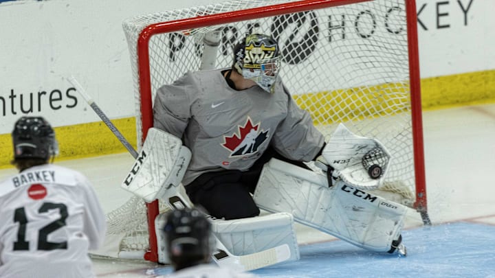 Aug 2, 2024; Plymouth, MI, USA; Canada's goaltender Joshua Ravensbergen (1) makes a glove save against Finland during the first period of the 2024 World Junior Summer Showcase at USA Hockey Arena. Mandatory Credit: David Reginek-Imagn Images