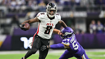 Dec 8, 2024; Minneapolis, Minnesota, USA; Atlanta Falcons tight end Kyle Pitts (8) gets yards after the catch as Minnesota Vikings linebacker Kamu Grugier-Hill (54) attempts to make the tackle during the fourth quarter at U.S. Bank Stadium. Mandatory Credit: Jeffrey Becker-Imagn Images