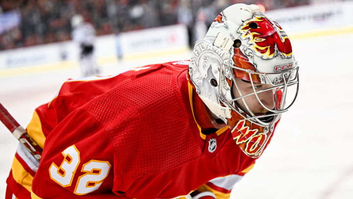 Apr 14, 2024; Calgary, Alberta, CAN; Calgary Flames goaltender Dustin Wolf (32) skates back to his net after a stoppage in play during the second period against the Arizona Coyotes at Scotiabank Saddledome. Mandatory Credit: Brett Holmes-USA TODAY Sports