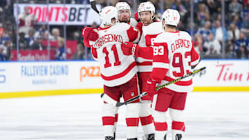 Apr 17, 2025; Toronto, Ontario, CAN; Detroit Red Wings defenseman Justin Holl (3) scores a goal and celebrates with right wing Vladimir Tarasenko (11) against the Toronto Maple Leafs during the second period at Scotiabank Arena. Mandatory Credit: Nick Turchiaro-Imagn Images