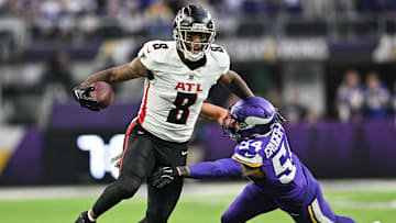 Dec 8, 2024; Minneapolis, Minnesota, USA; Atlanta Falcons tight end Kyle Pitts (8) gets yards after the catch as Minnesota Vikings linebacker Kamu Grugier-Hill (54) attempts to make the tackle during the fourth quarter at U.S. Bank Stadium. Mandatory Credit: Jeffrey Becker-Imagn Images
