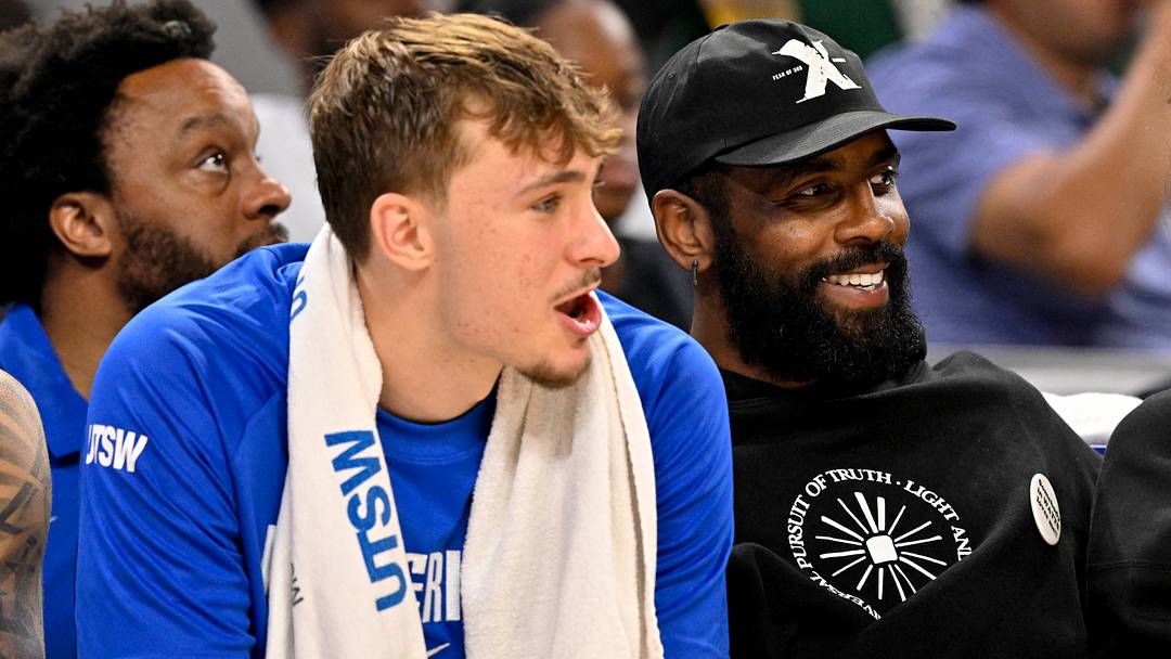Oct 6, 2025; Fort Worth, Texas, USA; Dallas Mavericks forward Cooper Flagg (left) and guard Kyrie Irving (right) watch the game against the Oklahoma City Thunder during the second half at Dickie's Arena. Mandatory Credit: Jerome Miron-Imagn Images