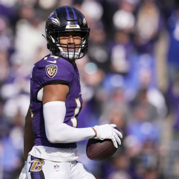 Nov 12, 2023; Baltimore, Maryland, USA; Baltimore Ravens safety Kyle Hamilton (14) celebrates after scoring a touchdown against the Cleveland Browns during the first quarterat M&T Bank Stadium. Mandatory Credit: Jessica Rapfogel-USA TODAY Sports