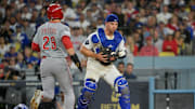 Oct 1, 2025; Los Angeles, California, USA; Los Angeles Dodgers catcher Ben Rortvedt (47) fields a throw to get an out Cincinnati Reds center fielder TJ Friedl (29) at home plate in the sixth inning during game two of the Wildcard round for the 2025 MLB playoffs at Dodger Stadium. Mandatory Credit: Jayne Kamin-Oncea-Imagn Images