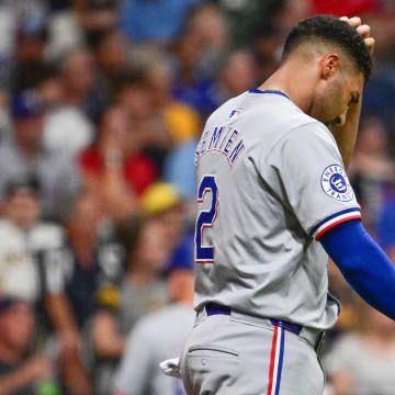 Jun 25, 2024; Milwaukee, Wisconsin, USA; Texas Rangers second baseman Marcus Semien (2) reacts after striking out in the eighth inning against the Milwaukee Brewers at American Family Field. Mandatory Credit: Benny Sieu-USA TODAY Sports