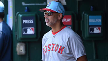 Jul 4, 2025; Washington, District of Columbia, USA; Boston Red Sox manager Alex Cora (13) stands in the dugout during the eighth inning of a game against the Washington Nationals at Nationals Park. Mandatory Credit: Rafael Suanes-Imagn Images