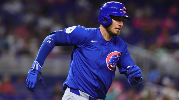 Aug 23, 2024; Miami, Florida, USA; Chicago Cubs right fielder Cody Bellinger (24) runs toward second base after hitting a double against the Miami Marlins during the fifth inning at loanDepot Park.