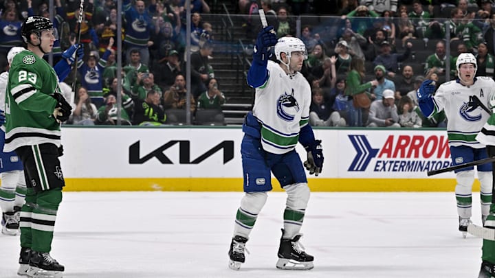 Apr 8, 2025; Dallas, Texas, USA; Vancouver Canucks left wing Jake DeBrusk (74) celebrates center Pius Suter (not pictured) scoring the game tying goal against the Dallas Stars during the third period at the American Airlines Center. Mandatory Credit: Jerome Miron-Imagn Images Apr 8, 2025; Dallas, Texas, USA; Vancouver Canucks left wing Jake DeBrusk (74) celebrates center Pius Suter (not pictured) scoring the game tying goal against the Dallas Stars during the third period at the American Airlines Center. Mandatory Credit: Jerome Miron-Imagn Images