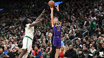 Mar 8, 2025; Boston, Massachusetts, USA; Los Angeles Lakers guard Austin Reaves (15) attempts a three-point basket against Boston Celtics guard Jrue Holiday (4) during the second quarter at the TD Garden. Mandatory Credit: Brian Fluharty-Imagn Images