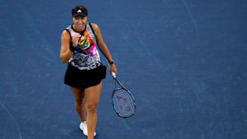 American tennis star Jessica Pegula smiles after hitting a shot. 