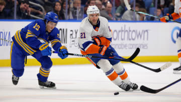 Mar 14, 2024; Buffalo, New York, USA;  Buffalo Sabres center Peyton Krebs (19) defends as New York Islanders center Kyle Palmieri (21) passes the puck during the first period at KeyBank Center. Mandatory Credit: Timothy T. Ludwig-USA TODAY Sports