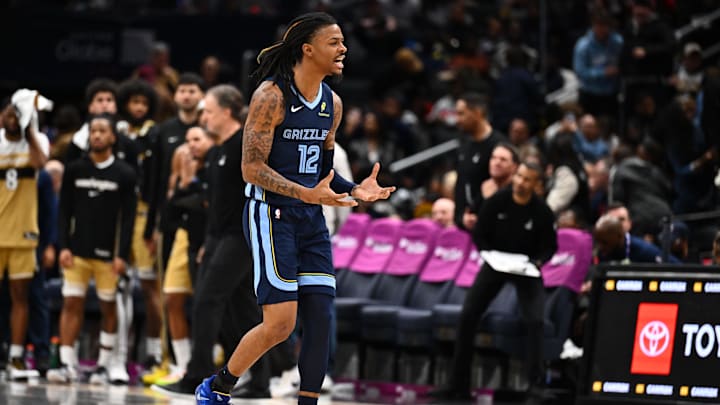 Dec 28, 2025; Washington, District of Columbia, USA; Memphis Grizzlies guard Ja Morant (12) reacts after a three point shot against the Washington Wizards during the second half at Capital One Arena. Mandatory Credit: Brad Mills-Imagn Images