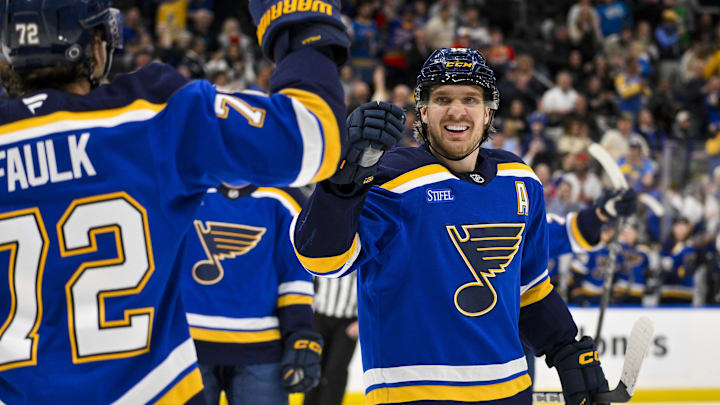 Mar 25, 2025; St. Louis, Missouri, USA;  St. Louis Blues center Robert Thomas (18) is congratulated by defenseman Justin Faulk (72) after scoring against the Montreal Canadiens during the second period at Enterprise Center. Mandatory Credit: Jeff Curry-Imagn Images