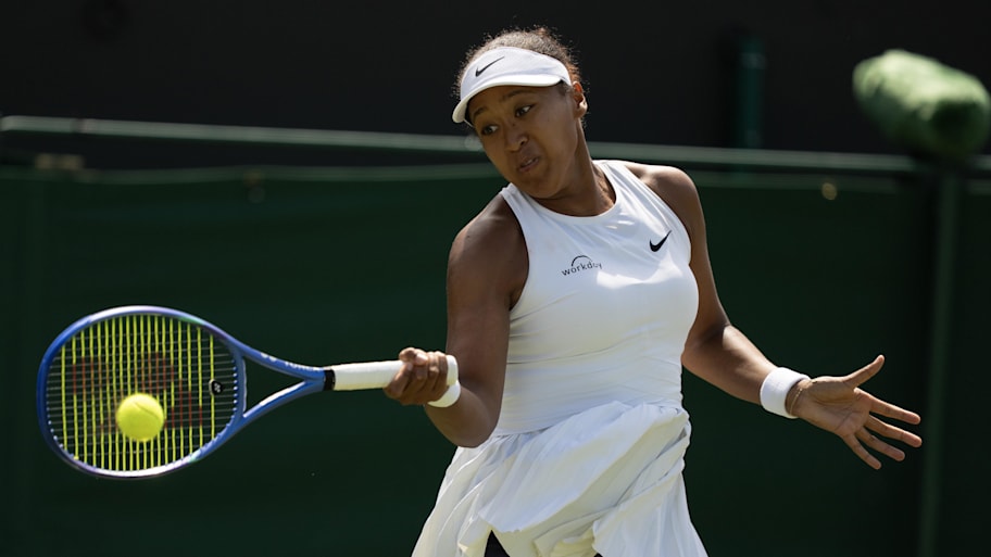 Naomi Osaka of Japan returns a shot during her match against Anastasia Pavlyuchenkova on day five of the 2025 Wimbledon tournament. | Susan Mullane-Imagn Images
