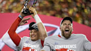 Kansas City Chiefs quarterback Patrick Mahomes raises the Lamar Hunt Trophy with tight end Travis Kelce after the AFC championship NFL game between the Cincinnati Bengals and the Kansas City Chiefs 