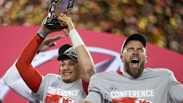 Kansas City Chiefs quarterback Patrick Mahomes raises the Lamar Hunt Trophy with tight end Travis Kelce after the AFC championship NFL game between the Cincinnati Bengals and the Kansas City Chiefs 