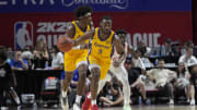 Jul 12, 2024; Las Vegas, NV, USA; Los Angeles Lakers guard Bronny James (9) dribbles the ball during the second half against the Houston Rockets at the Thomas & Mack Center. Mandatory Credit: Lucas Peltier-USA TODAY Sports