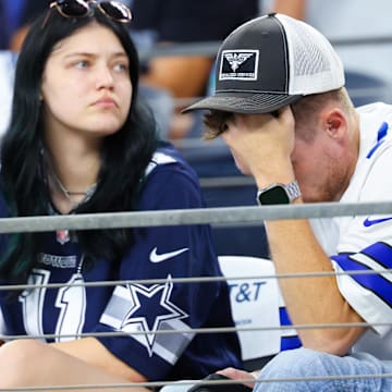Dallas Cowboys fans react during the second half against the Baltimore Ravens.