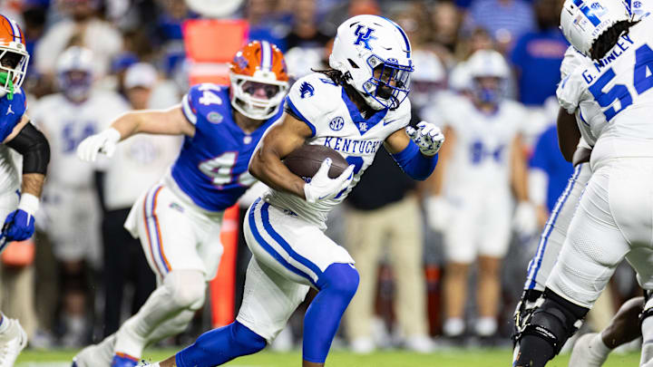 Oct 19, 2024; Gainesville, Florida, USA; Kentucky Wildcats running back Demie Sumo-Karngbaye (0) rushes with the ball against the Florida Gators during the first half at Ben Hill Griffin Stadium. Mandatory Credit: Matt Pendleton-Imagn Images