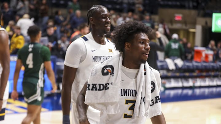 Nov 30, 2025; Morgantown, West Virginia, USA; West Virginia Mountaineers guard Honor Huff (3) celebrates with teammates after defeating the Mercyhurst Lakers at Hope Coliseum. Mandatory Credit: Ben Queen-Imagn Images