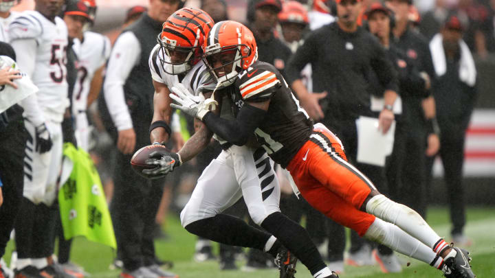 Cincinnati Bengals wide receiver Ja'Marr Chase (1) is pushed out of bounds after a catch by Cleveland Browns cornerback Denzel Ward (21) in the third quarter of an NFL football game between the Cincinnati Bengals and Cleveland Browns, Sunday, Sept. 10, 2023, at Cleveland Browns Stadium in Cleveland.