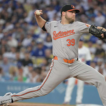 Aug 28, 2024; Los Angeles, California, USA;  Baltimore Orioles starting pitcher Corbin Burnes (39) delivers to the plate in the first inning against the Los Angeles Dodgers at Dodger Stadium.