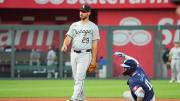 Jul 19, 2024; Kansas City, Missouri, USA; Chicago White Sox shortstop Paul DeJong (29) looks on as Kansas City Royals third base Maikel Garcia (11) steals second base in the fifth inning at Kauffman Stadium. Mandatory Credit: Denny Medley-USA TODAY Sports