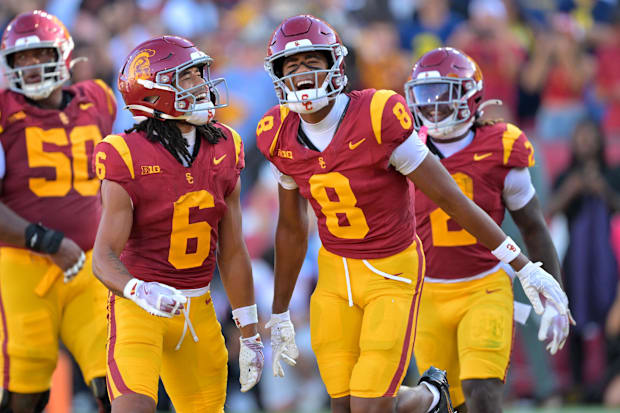 USC wide receivers Makai Lemon and Ja’Kobi Lane celebrate a touchdown.