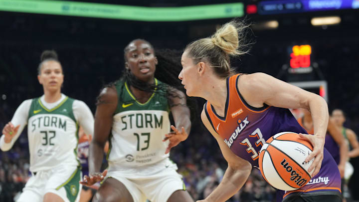 May 17, 2025; Phoenix, Arizona, USA; Phoenix Mercury guard Sami Whitcomb (33) dribbles against Seattle Storm forward Ezi Magbegor (13) during the second half at Footprint Center. Mandatory Credit: Joe Camporeale-Imagn Images