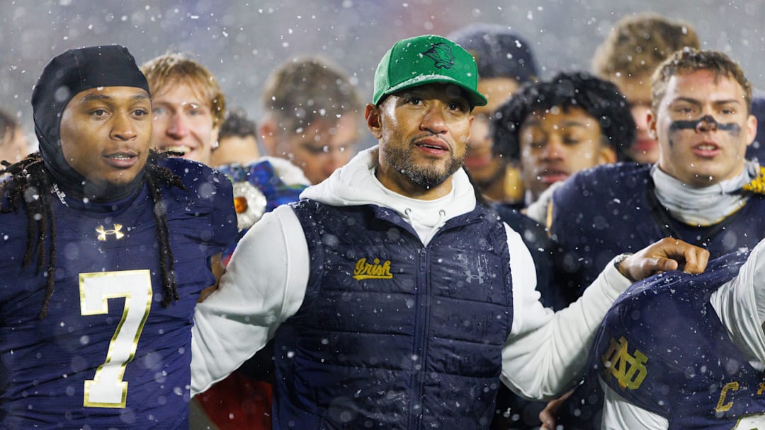 Notre Dame head coach Marcus Freeman celebrates with his players after winning a NCAA football game 49-10 against Navy at Notre Dame Stadium on Saturday, Nov. 8, 2025, in South Bend.