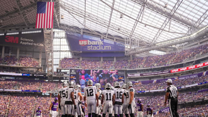 Aug 10, 2024; Minneapolis, Minnesota, USA; Las Vegas Raiders quarterback Aidan O'Connell (12) in the huddel against the Minnesota Vikings in the first quarter at U.S. Bank Stadium. Mandatory Credit: Brad Rempel-USA TODAY Sports