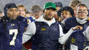 Notre Dame head coach Marcus Freeman celebrates with his players after winning a NCAA football game 49-10 against Navy at Notre Dame Stadium on Saturday, Nov. 8, 2025, in South Bend.