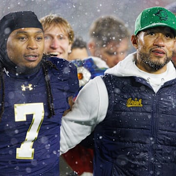 Notre Dame head coach Marcus Freeman celebrates with his players after winning a NCAA football game 49-10 against Navy at Notre Dame Stadium on Saturday, Nov. 8, 2025, in South Bend.