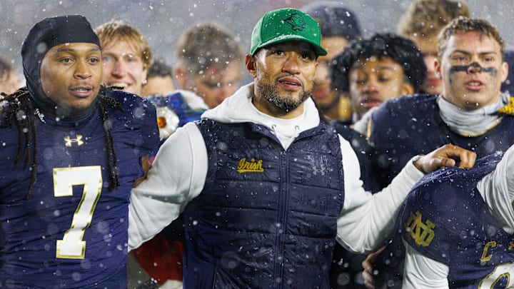 Notre Dame head coach Marcus Freeman celebrates with his players after winning a NCAA football game 49-10 against Navy at Notre Dame Stadium on Saturday, Nov. 8, 2025, in South Bend.