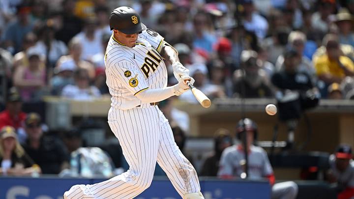 Sep 7, 2026; San Diego, California, USA;  San Diego Padres third baseman Manny Machado (13) hits an RBI single during the third inning against the Washington Nationals at Petco Park.  Mandatory Credit: Denis Poroy-Imagn Images