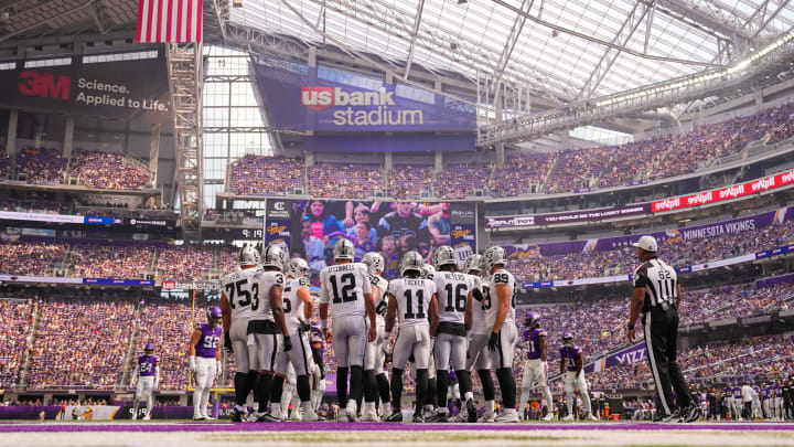 Aug 10, 2024; Minneapolis, Minnesota, USA; Las Vegas Raiders quarterback Aidan O'Connell (12) in the huddel against the Minnesota Vikings in the first quarter at U.S. Bank Stadium. Mandatory Credit: Brad Rempel-USA TODAY Sports