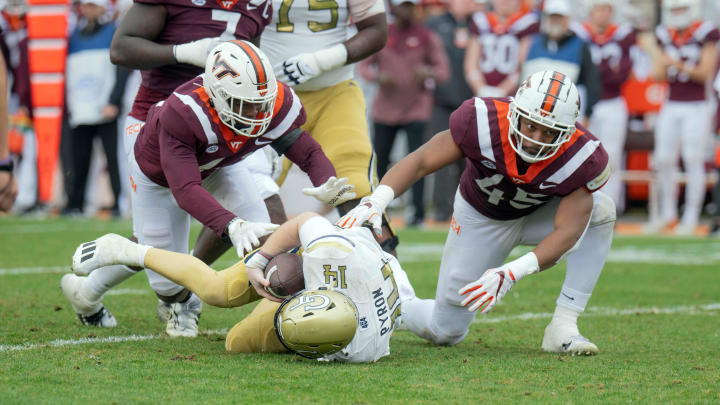 Nov 5, 2022; Blacksburg, Virginia, USA; Virginia Tech Hokies defensive lineman Jaylen Griffin (41) and Virginia Tech Hokies defensive lineman sack Virginia Tech Hokies defensive lineman TyJuan Garbutt (45) sack Georgia Tech Yellow Jackets quarterback Zach Pyron (14)  in the firsbhalf at Lane Stadium. Mandatory Credit: Lee Luther Jr.-USA TODAY Sports