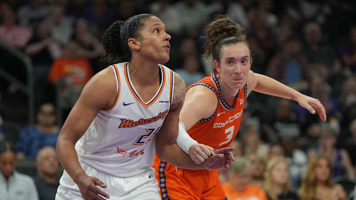 Aug 5, 2025; Phoenix, Arizona, USA; Phoenix Mercury forward Alyssa Thomas (25) and Connecticut Sun guard Marina Mabrey (3) fight for position in the second half at Footprint Center. Mandatory Credit: Rick Scuteri-Imagn Images