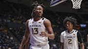 Dec 3, 2025; Morgantown, West Virginia, USA; West Virginia Mountaineers guard Chance Moore (13) celebrates after a play during the second half against the Coppin State Eagles at Hope Coliseum. Mandatory Credit: Ben Queen-Imagn Images