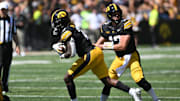 Aug 31, 2024; Iowa City, Iowa, USA; Iowa Hawkeyes running back Kaleb Johnson (2) takes the handoff from quarterback Cade McNamara (not pictured) against the Illinois State Redbirds during the fourth quarter at Kinnick Stadium. Mandatory Credit: Jeffrey Becker-Imagn Images