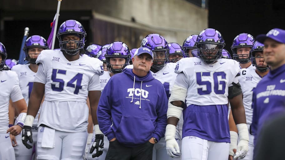 TCU coach Sonny Dykes leads his team onto the field.